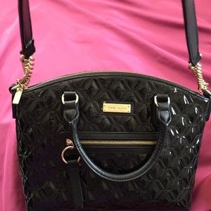 Black patent leather quilted handbag